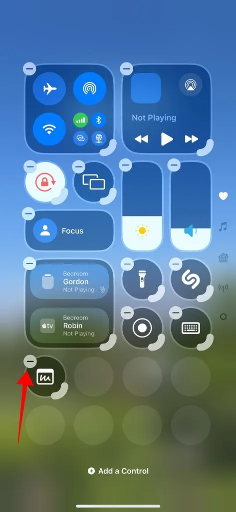 Tap the '-' icon in the top-right of a control or shortcuts in the Control Center to delete it.